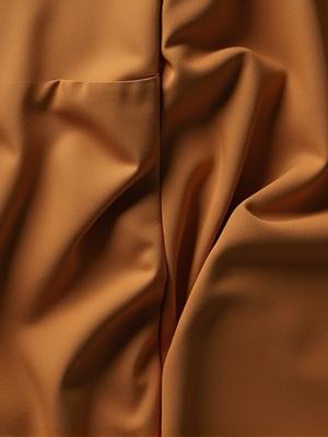 Organic cotton relaxed-fit trousers in earthy brown, with '100% Biodegradable' badge