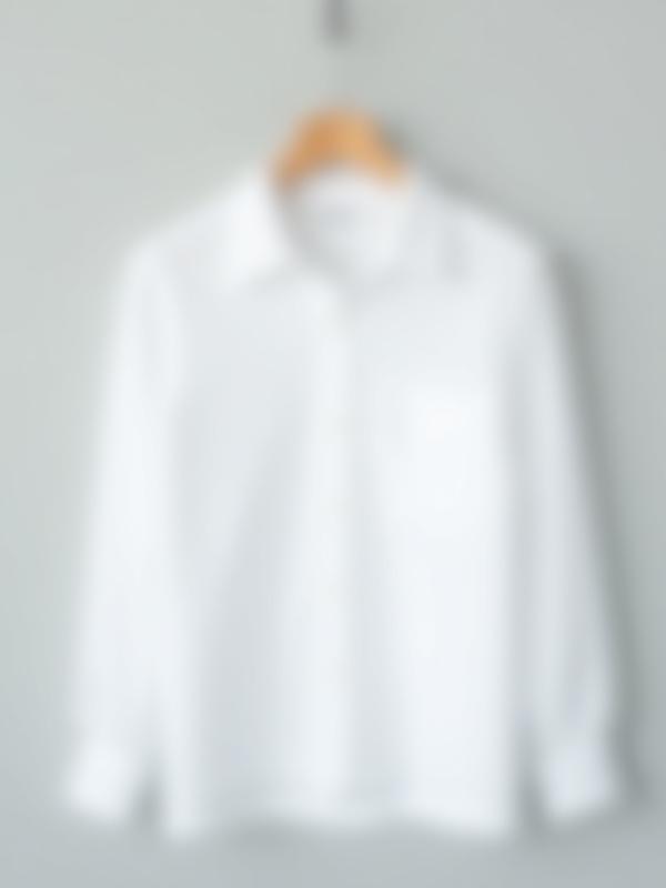 Crisp, organic cotton shirt in a classic cut, on a wooden hanger
